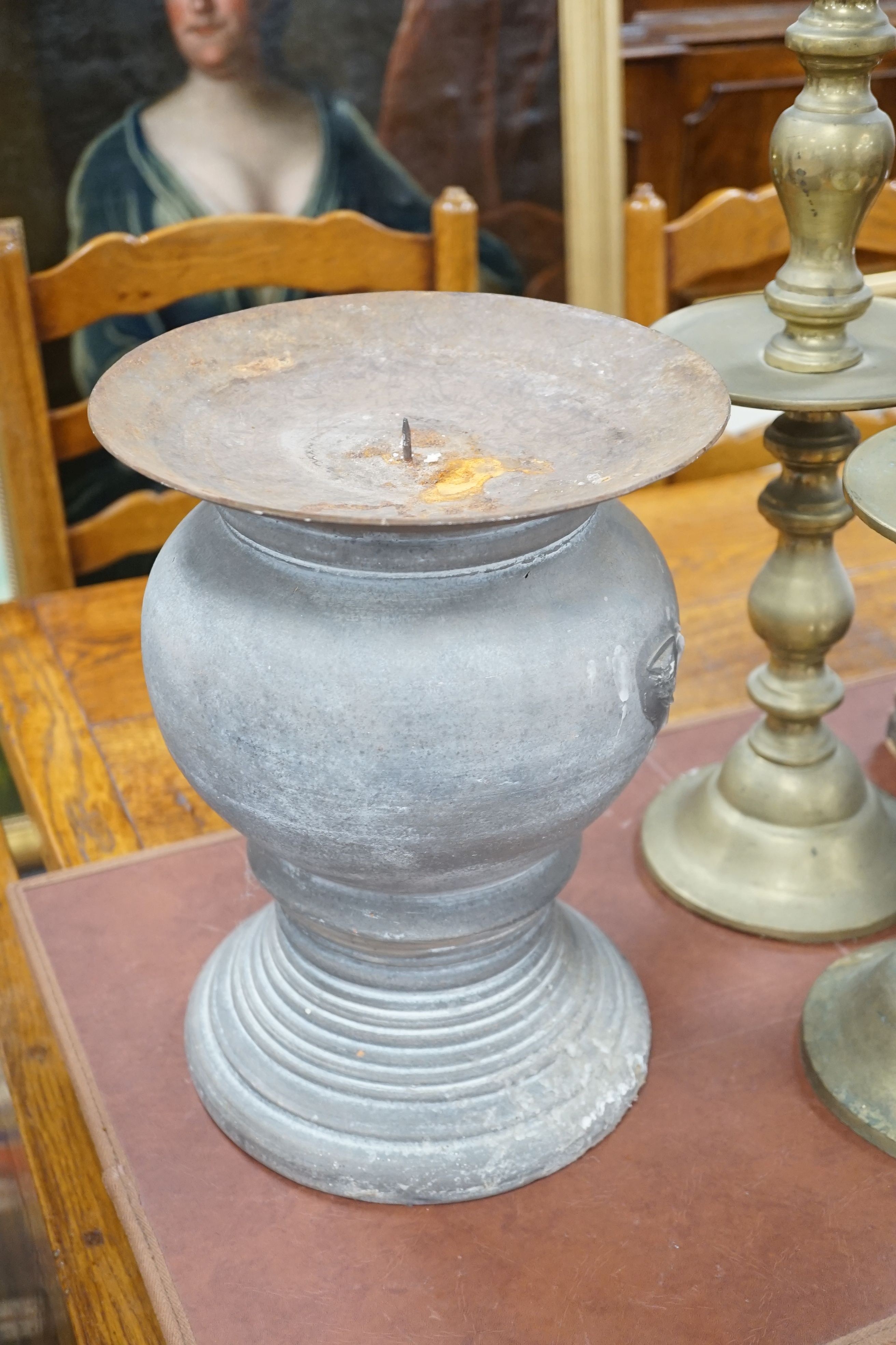 A pair of gilt carved candlesticks, a large turned candlestick, a pair of brass candlesticks and a squat metal candle stick (6), tallest 140cms.